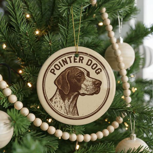 A Christmas tree decorated with ornaments, including a circular ornament with a brown and white dog image and the text "POINTER DOG" on it.