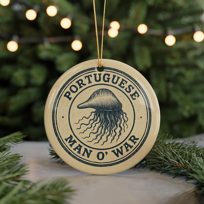 A circular ornament with the text "PORTUGUESE MAN O' WAR" printed on it, featuring an illustration of a jellyfish.