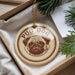 A round ornament with a pug dog image and the text "PUG DOG" is displayed in a box, surrounded by pine branches.