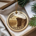 A round ornament with the text "PULPIT ROCK NORWAY" printed on it, hanging from a string.
