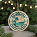 A circular ornament with the text "RANGIRO A FRENCH POLYNESIA" and a palm tree design, hanging from a string.