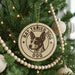 A Christmas tree decorated with ornaments, including a circular ornament with a picture of a Rat Terrier Dog and the text "RAT TRIPER DOG DOG" around the edge.
