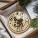 A decorative ornament featuring a dog's head and the text "RAT TRIPER DOG" is displayed in a box with pine branches.