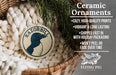 Ceramic ornaments, featuring a ceramic penguin ornament with a wavy pattern and text, are displayed in a wicker basket.