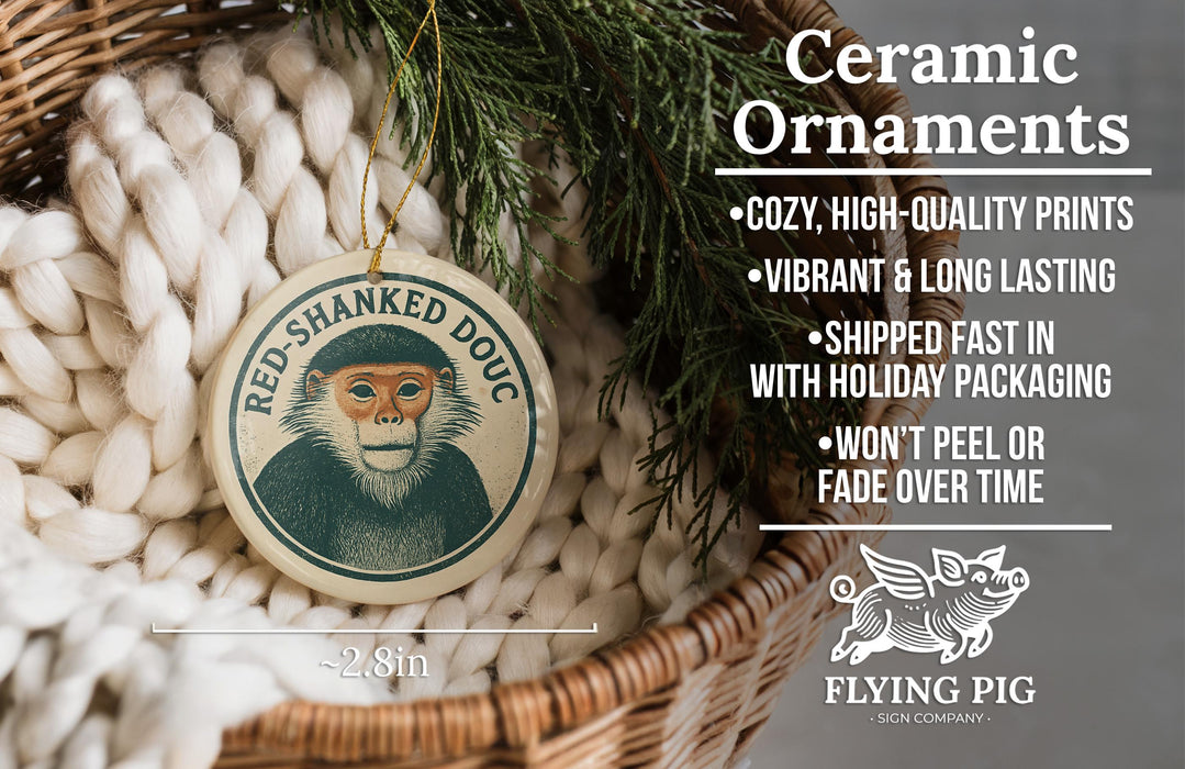 Ceramic ornaments featuring a monkey, with text describing the ornaments as "cozy, high-quality prints, vibrant and long lasting, shipped fast in with holiday packaging, won't peel or fade over time" and the company name "FLYING PIG - SIGN COMPANY".