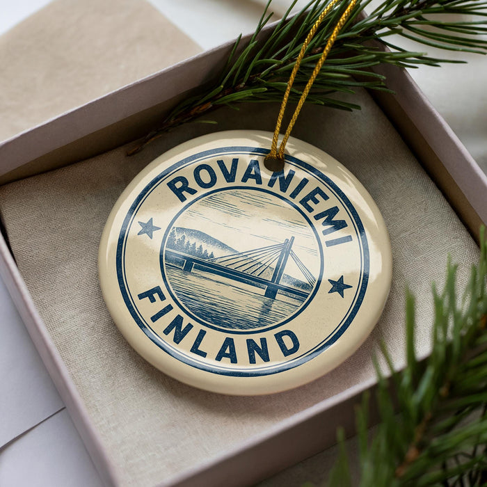 A circular ornament with the text "ROVANIEMI FINLAND" printed on it, surrounded by pine branches.