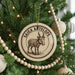 A Christmas tree decorated with ornaments, including a circular ornament with a goat illustration and the text "SAIGA ANTELOPE".