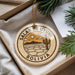 A round ornament with the text "SALAR DE UYUNI BOLIVIA" and an illustration of a desert landscape with a cactus.