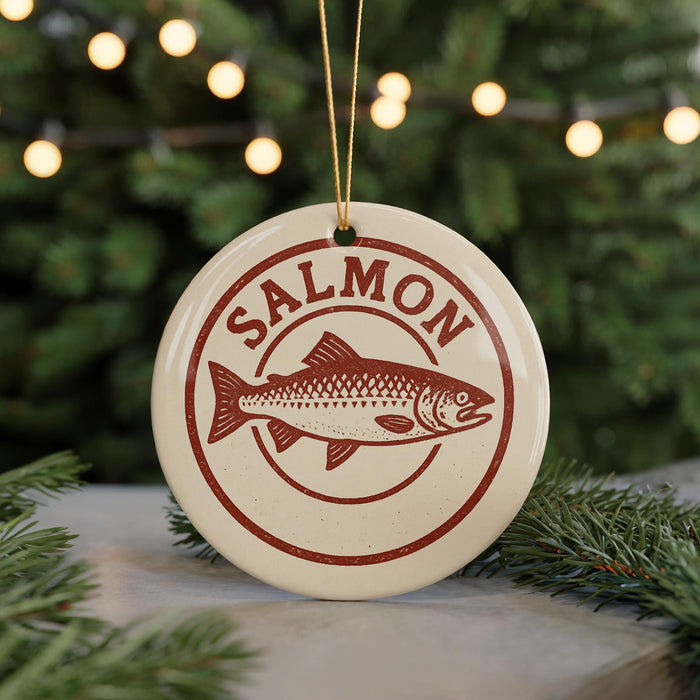 A round ornament with the word "SALMON" printed on it, featuring a fish illustration.