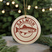 A round ornament with the word "SALMON" printed on it, featuring a fish illustration.