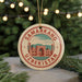 A circular ornament with the text "SAMARKAND UZBEKISTAN" and an illustration of a mosque, hanging from a string.