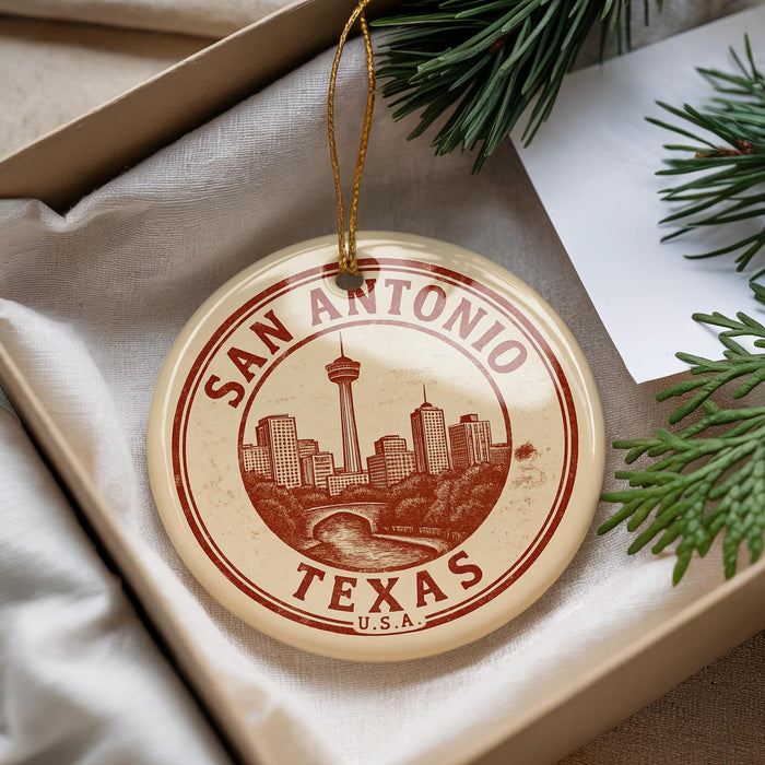 A circular ornament with the text "SAN ANTONIO TEXAS" and a graphic of the city skyline, hanging from a string.