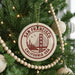 A round ornament on a Christmas tree, featuring the Golden Gate Bridge and the text "SAN FRANCISCO CALIFORNIA USA".