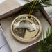 A circular ornament featuring a close-up of a Scottish deerhound's head, with the text "SCOTTISH DEERHOUND" around the edge.