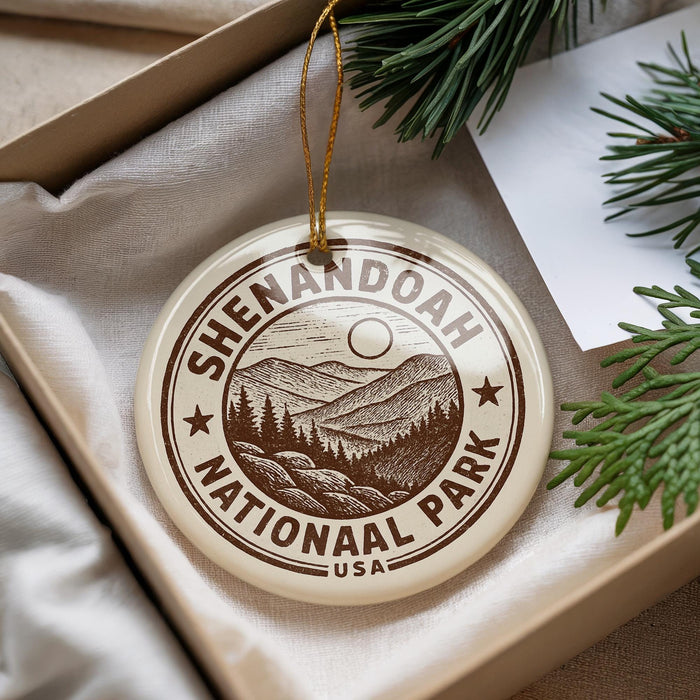 A circular ornament with the text "Shenandoah National Park" and a mountain landscape design, hanging from a string.