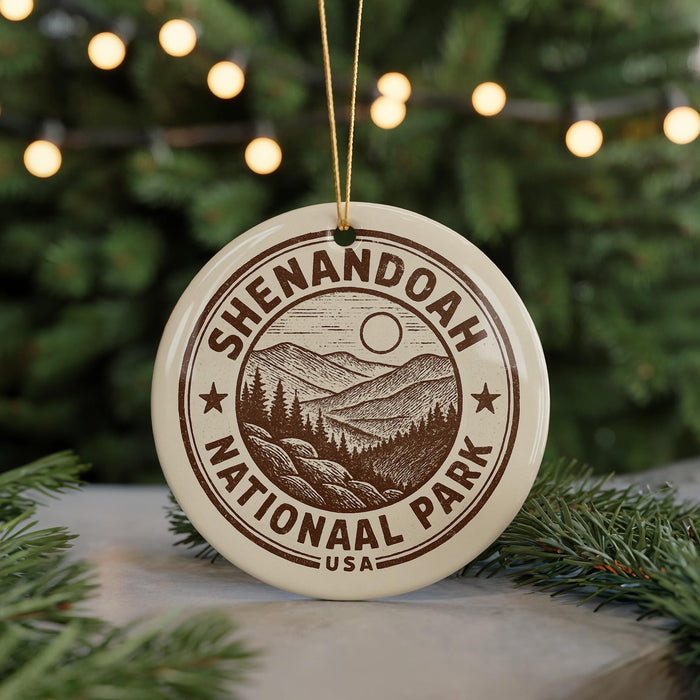 A circular ornament with the text "SHENANDOAH NATIONAL PARK USA" printed on it, featuring a mountain landscape and pine trees.