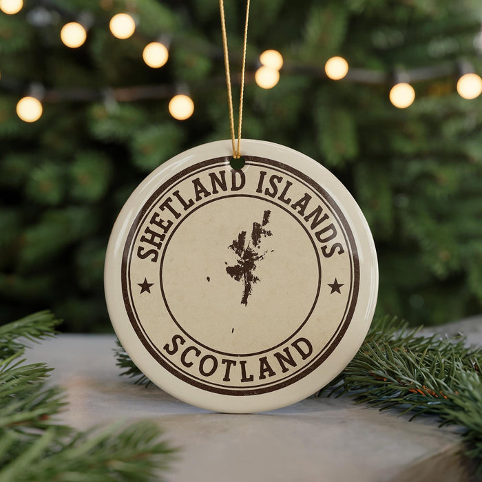 A circular ornament with the text "SHETLAND ISLANDS SCOTLAND" printed on it, surrounded by a Christmas tree and twinkling lights.