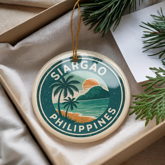 A round ornament with the text "SIARGAO PHILIPPINES" and a tropical beach scene, hanging from a string.