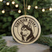 A round ornament featuring a close-up of a Siberian husky's head, with the text "SIBERIAN HUSKY" around the edge.