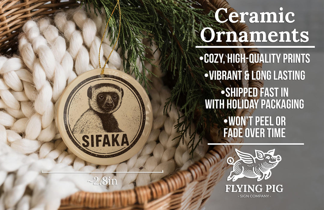 Ceramic ornaments featuring a ceramic image of a lemur, with text describing the ornaments as cozy, high-quality prints, vibrant, long-lasting, and shipped fast in holiday packaging.