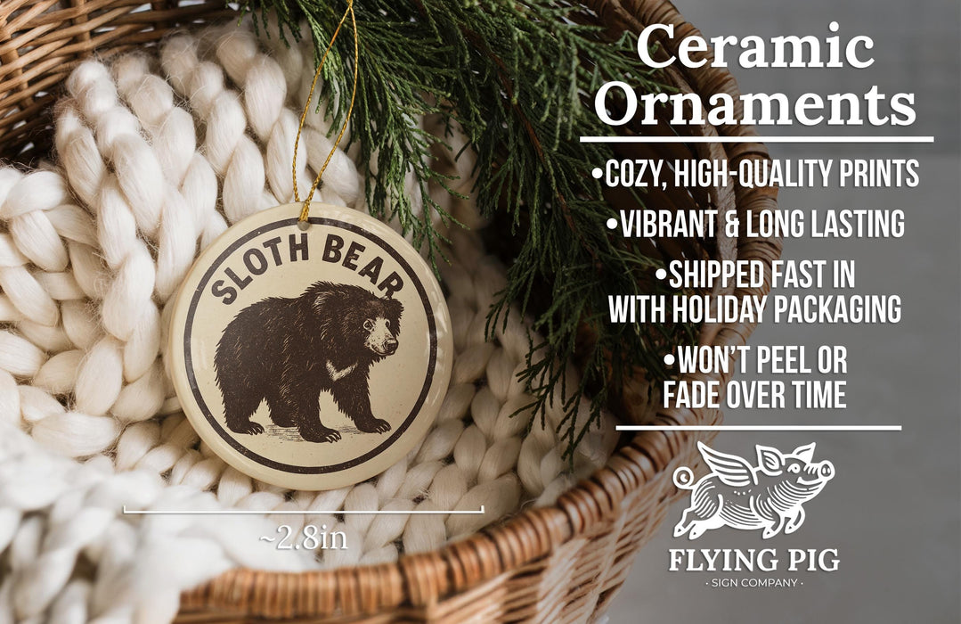 Ceramic ornaments featuring a sloth bear design, with a wicker basket and greenery in the background.