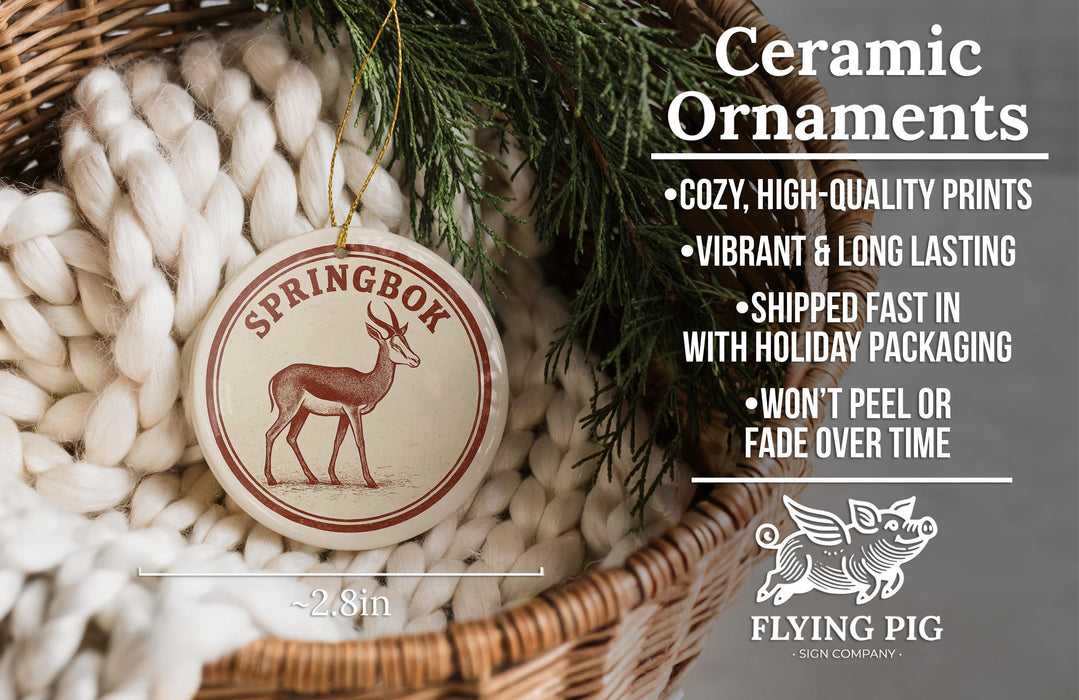 Ceramic ornaments, featuring a Springbox deer ornament, are displayed in a woven basket.