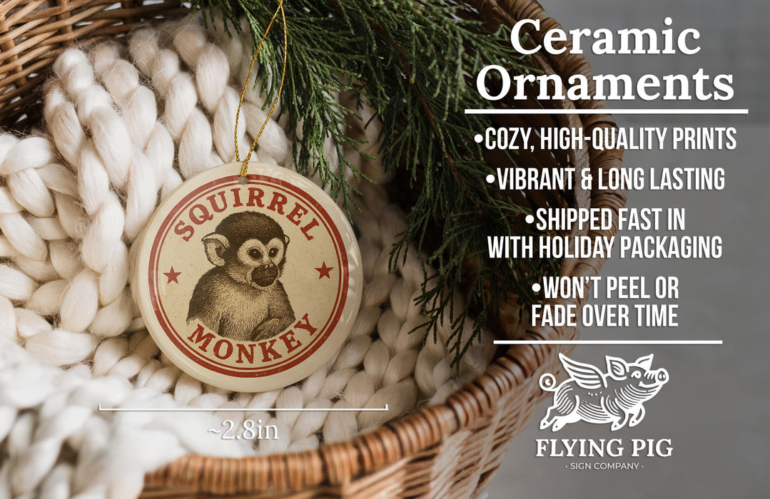 Ceramic ornaments featuring a squirrel monkey design, with a wicker basket and greenery in the background.