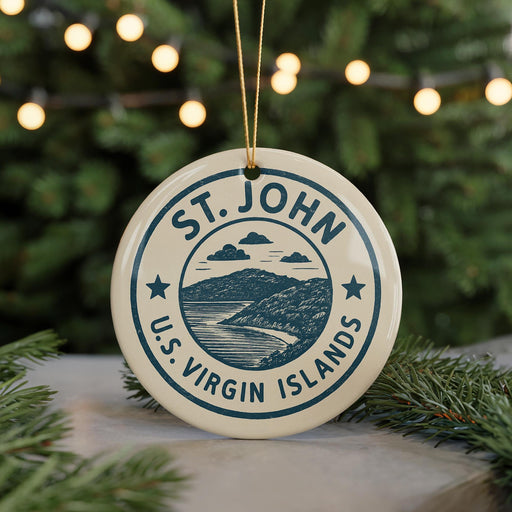 A circular ornament with the text "ST. JOHN U.S. VIRGIN ISLANDS" and a graphic of a mountain and ocean, hanging from a string.