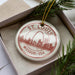 A circular ornament with the text "ST. LOUIS" and "MISSOURI - USA" printed on it, along with an illustration of the Gateway Arch in St. Louis, Missouri, USA.