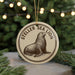 A round ornament featuring a seal on a tree branch, with the text "Steller Sea Lion" around the seal.