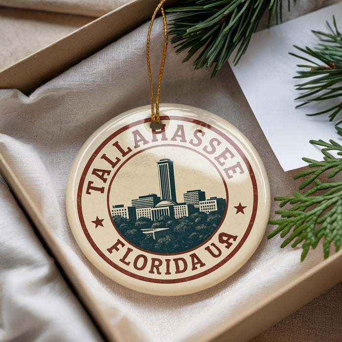 A circular ornament with the text "TALLASSEE FLORIDA UA" and an illustration of a city skyline.
