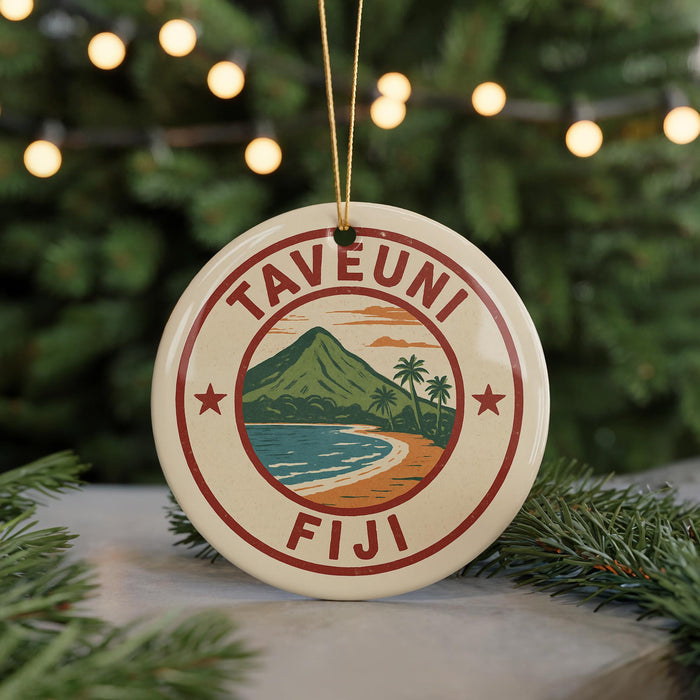 A round ornament with the text "TAVEUNI Fiji" and a tropical beach scene, surrounded by Christmas lights and greenery.