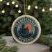 A circular ornament with the text "TRANSYLVANIA ROMANIA" and an illustration of a castle on a hill, surrounded by Christmas lights.