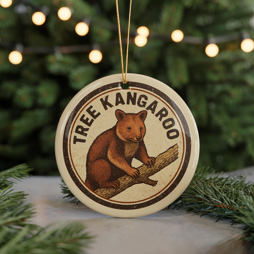 A circular ornament featuring a brown kangaroo sitting on a tree branch, with the text "TREE KANGAROO" around the image.