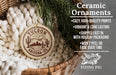 Ceramic ornaments, including a round ornament with a desert cityscape design, are displayed in a woven basket.