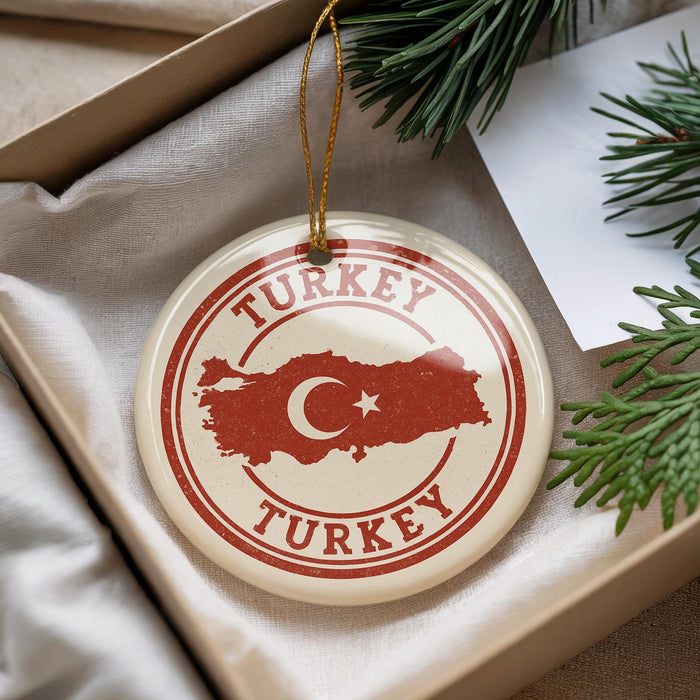 A circular ornament with the word "TURKEY" and a map of Turkey, hanging from a string.