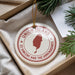 A round ornament with the text "UNION ISLAND" and a map of St. Vincent and the Grenadines, along with a pine branch, is displayed in a box.