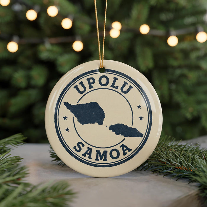 A circular ornament with the text "UPOLU SAMOA" and a map of the island of Samoa, surrounded by Christmas lights.