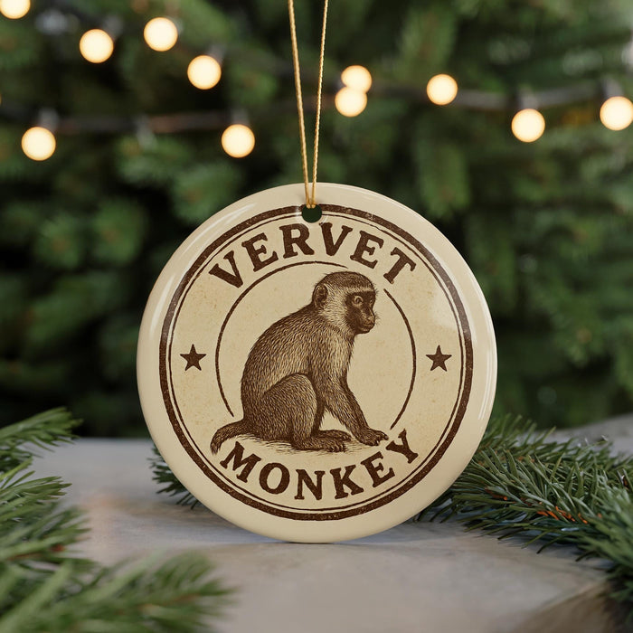 A round ornament with the text "VERVET MONKEY" and an illustration of a monkey sitting on a branch.