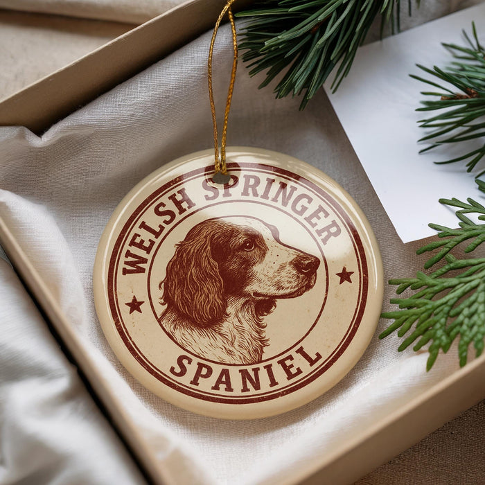A round ornament featuring a Welsh Springer Spaniel dog, with the text "WELSH SPRINGER SPANIEL" printed on it.