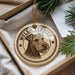 A circular ornament featuring a Welsh Terrier dog's head, with the text "WELSH TERRIER" printed on it.
