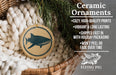Ceramic ornaments, featuring a ceramic ornament with a fish design, are displayed in a wicker basket.