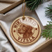 A round ornament with a dog image and the text "WIRERED VIZSLA" is displayed in a box with pine branches.