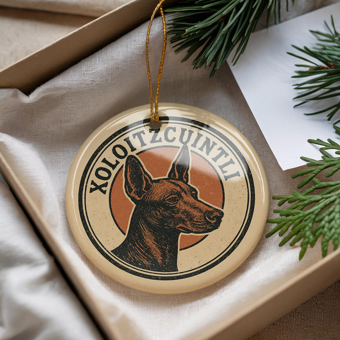 A circular ornament with a dog's head and the text "XOLOITZCINTL" is displayed in a box, surrounded by pine branches.