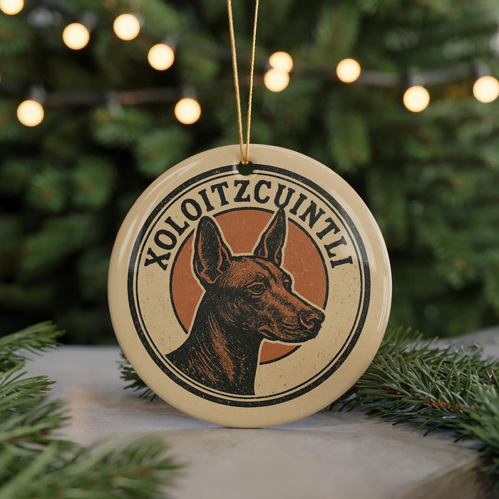 A circular ornament featuring a brown dog's head, with the text "XOLOITZCOUNTLI" written around the edge.