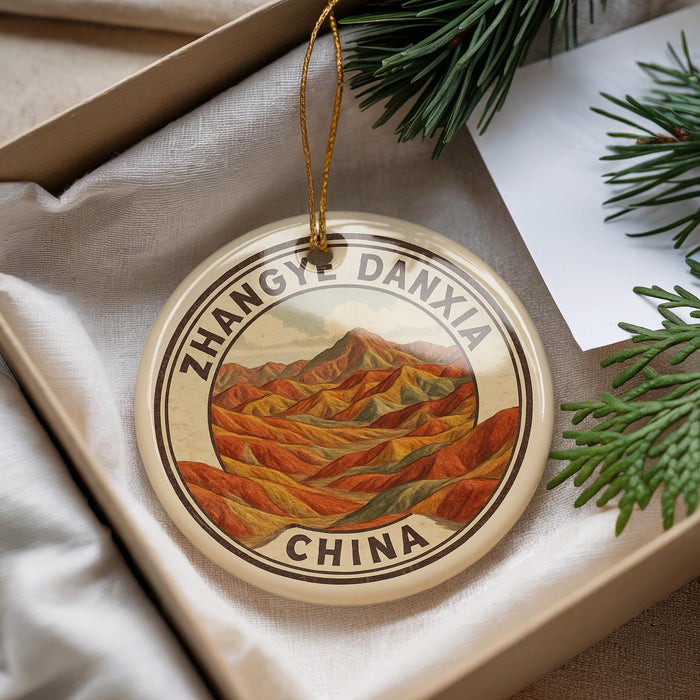 A decorative ornament with a mountain landscape and the text "Zhangy Daxia China" is displayed in a box with pine branches.