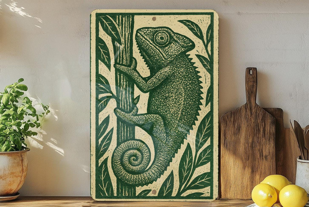 a wooden cutting board with a decorative green and white design depicting a chameleon climbing a tree.