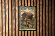 A wooden sign with a picture of a rabbit hutch and the text "RABBIT HUTCH" on it.
