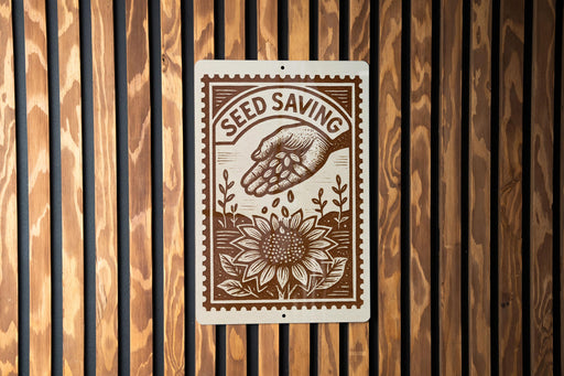 a sign with the text "SEED SAVING" and an illustration of a hand holding a flower, all set against a wooden background.