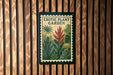 a poster or sign with a tropical plant garden theme, hanging on a wooden wall.